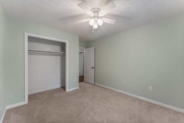 1506 Lokey Dr, Columbus, GA 31904 - unfurnished bedroom with carpet floors, a closet, a textured ceiling, baseboards, and a ceiling fan