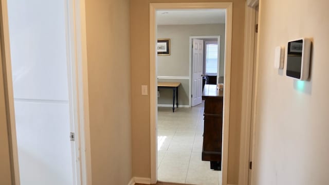 hallway with light tile patterned flooring