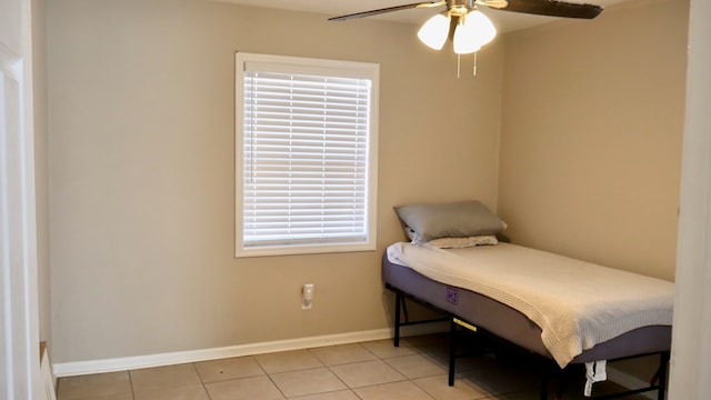 tiled bedroom with ceiling fan