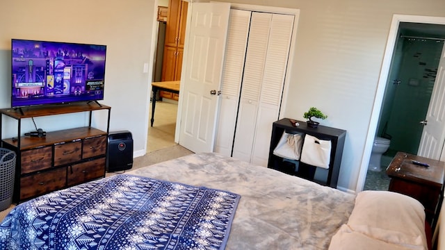 bedroom with ensuite bath and a closet