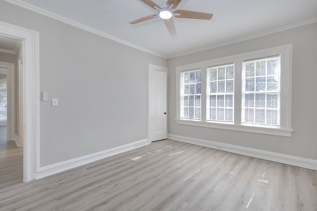 unfurnished room featuring light wood finished floors, ceiling fan, ornamental molding, and baseboards