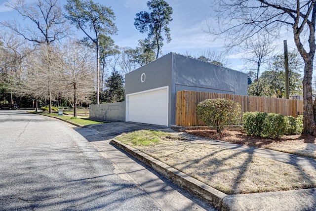 garage with fence