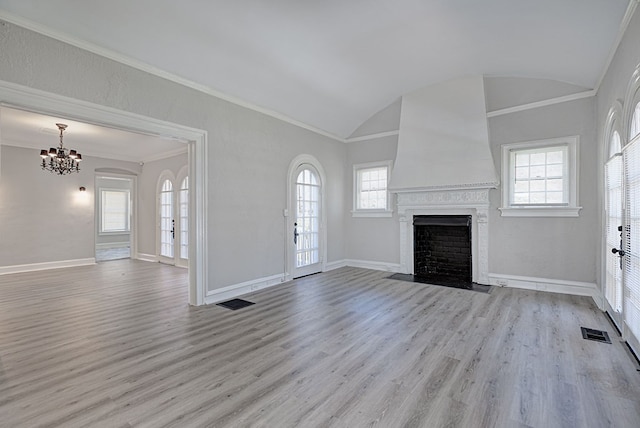 unfurnished living room with light wood-type flooring, a fireplace with flush hearth, visible vents, and baseboards