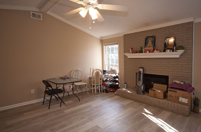 interior space with ceiling fan, hardwood / wood-style flooring, and lofted ceiling with beams