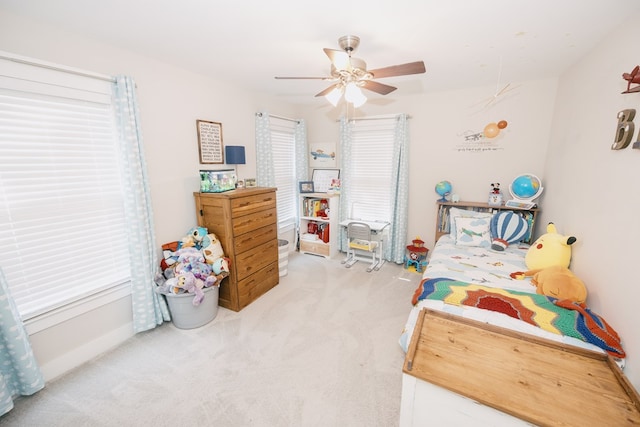 bedroom with ceiling fan and carpet floors