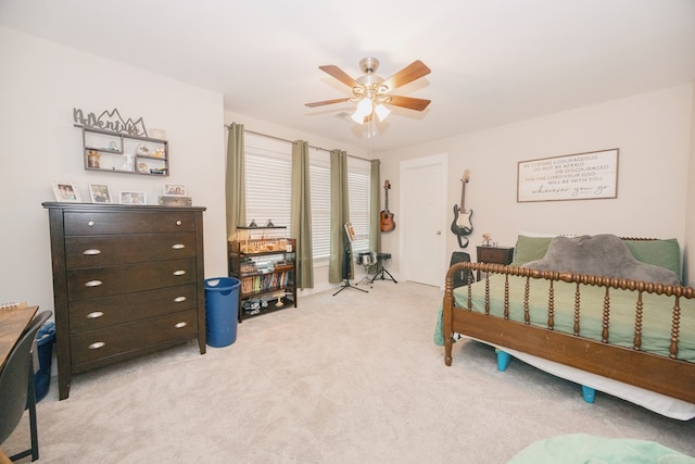 carpeted bedroom with ceiling fan