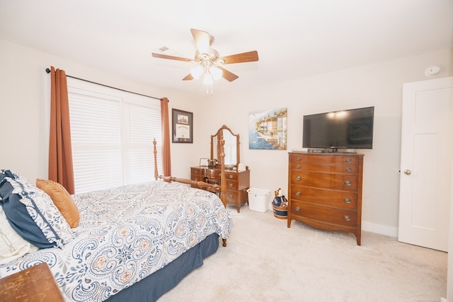 bedroom featuring ceiling fan and light colored carpet