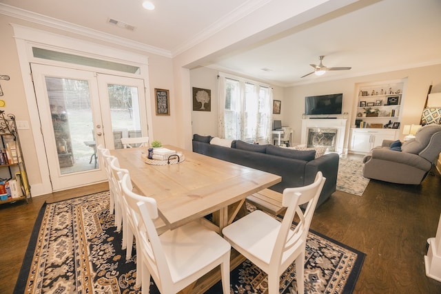 dining area with dark hardwood / wood-style floors, ceiling fan, and crown molding