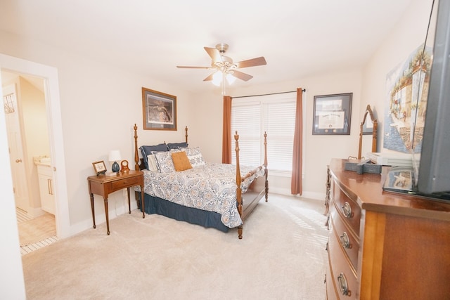 carpeted bedroom featuring ceiling fan and connected bathroom