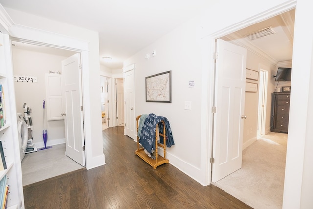 corridor featuring crown molding and dark hardwood / wood-style flooring