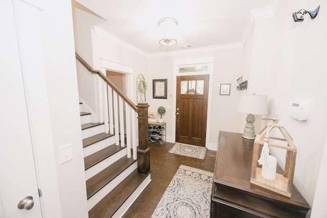 entrance foyer featuring ornamental molding and dark wood-type flooring