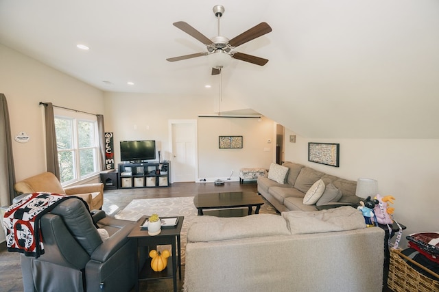 living room with ceiling fan, hardwood / wood-style floors, and lofted ceiling