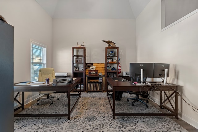 office featuring wood-type flooring and high vaulted ceiling