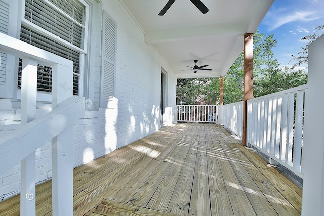 wooden deck with ceiling fan