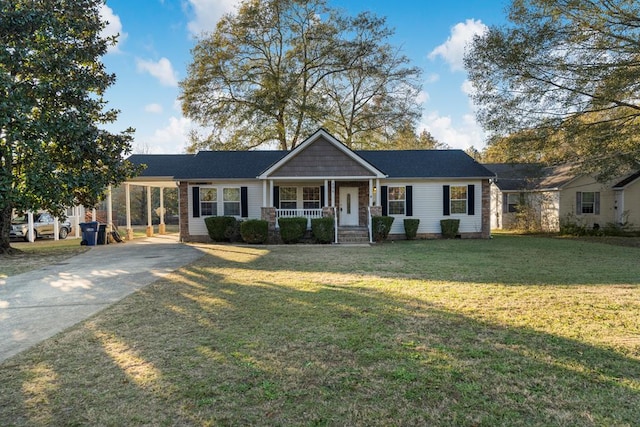 ranch-style home featuring a front lawn, a porch, and a carport