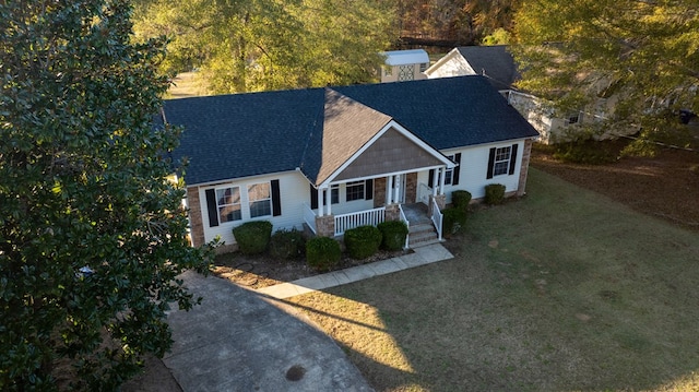 view of front of house featuring a porch and a front yard