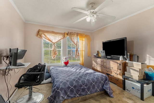 carpeted bedroom with ceiling fan, ornamental molding, and a textured ceiling