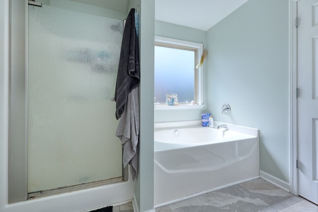 59 Misty Forest Dr, Phenix City, AL 36869 - full bath featuring a shower stall, a garden tub, and baseboards