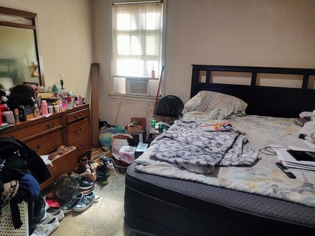 bedroom featuring cooling unit and carpet flooring