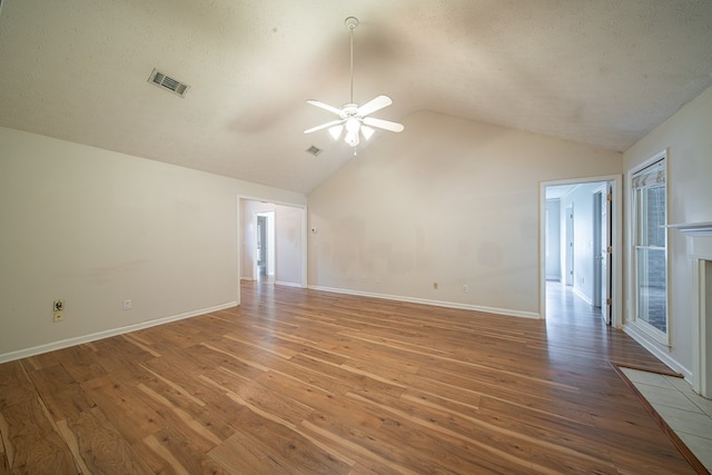 4021 Shade Valley Dr, Columbus, GA 31909 - unfurnished room with lofted ceiling, a ceiling fan, light wood-style floors, and a textured ceiling