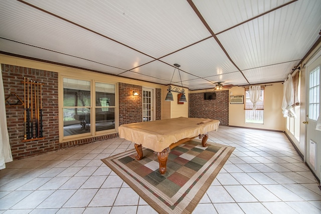 4021 Shade Valley Dr, Columbus, GA 31909 - rec room featuring brick wall, light tile patterned flooring, pool table, a wall mounted AC, and a ceiling fan