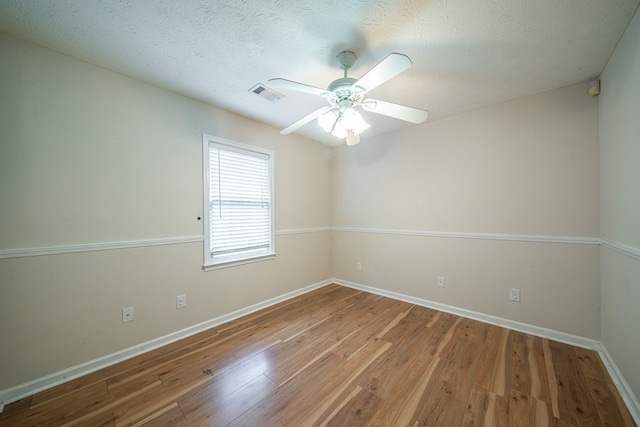 4021 Shade Valley Dr, Columbus, GA 31909 - empty room featuring wood finished floors, a ceiling fan, and a textured ceiling