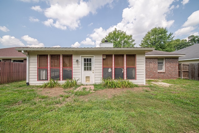 4021 Shade Valley Dr, Columbus, GA 31909 - rear view of house featuring a chimney, a fenced backyard, and brick siding