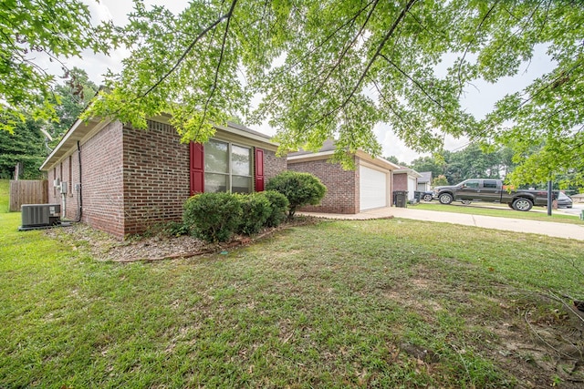 4021 Shade Valley Dr, Columbus, GA 31909 - view of side of home with brick siding, concrete driveway, a yard, and an attached garage