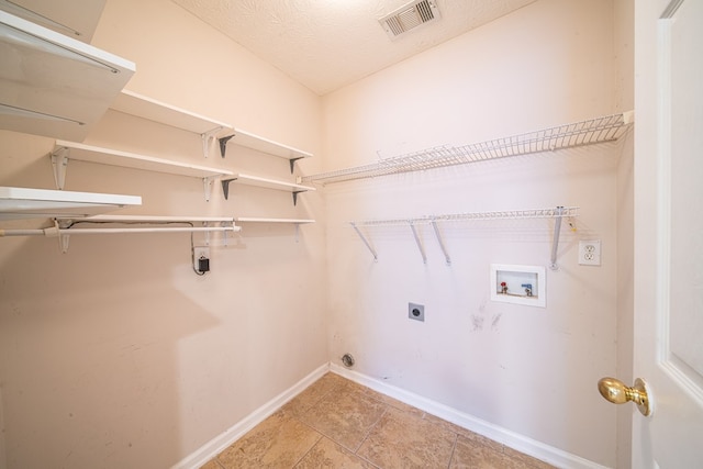 4021 Shade Valley Dr, Columbus, GA 31909 - laundry area with hookup for an electric dryer, washer hookup, and light tile patterned flooring