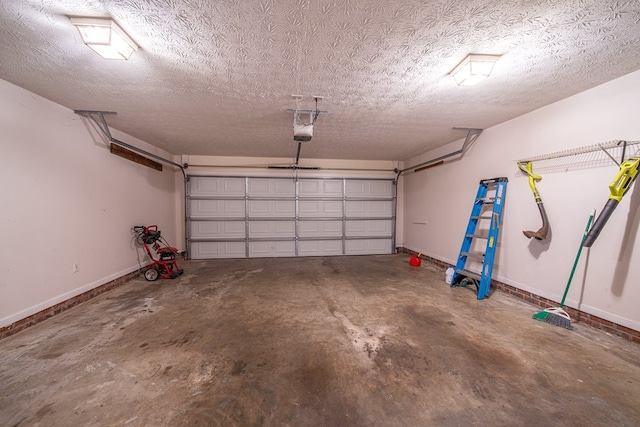 4021 Shade Valley Dr, Columbus, GA 31909 - garage featuring baseboards and a garage door opener