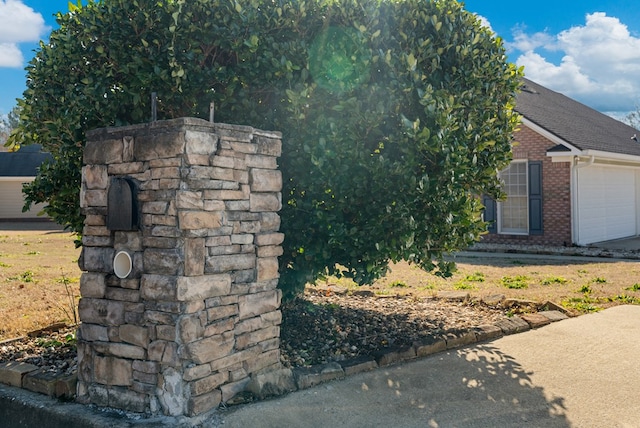 view of side of property with a garage