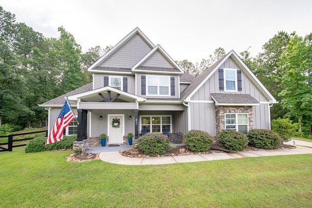 82 Rolling Meadows Way, Waverly Hall, GA 31831 - craftsman house featuring roof with shingles, board and batten siding, stone siding, and a porch