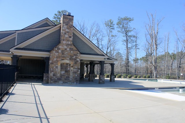 406 Lakeview Way, Lagrange, GA 30240 - view of home's exterior with a community pool and a chimney