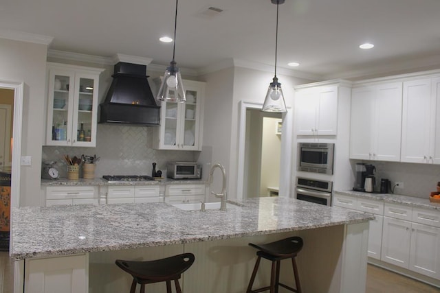 406 Lakeview Way, Lagrange, GA 30240 - kitchen with custom exhaust hood, appliances with stainless steel finishes, a sink, decorative backsplash, and white cabinetry