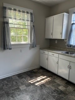 kitchen with white cabinets and sink