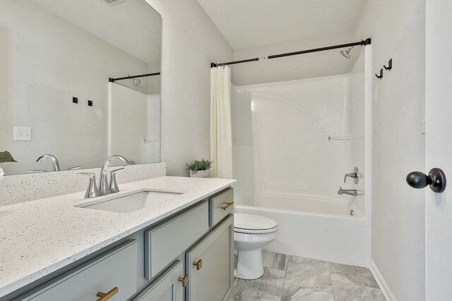 full bathroom with vanity, shower / bath combo, and toilet