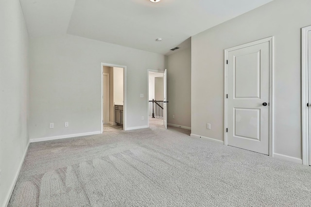 unfurnished bedroom with light colored carpet