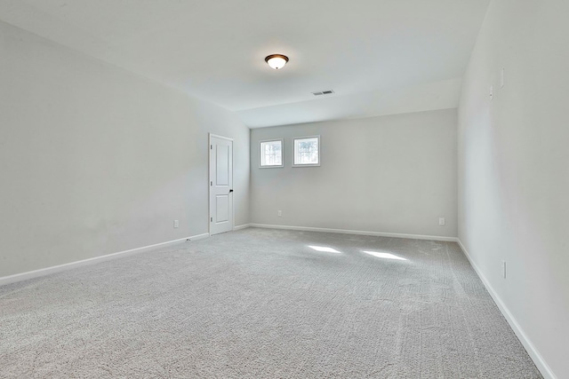 unfurnished room featuring carpet flooring