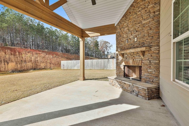 view of patio with an outdoor stone fireplace