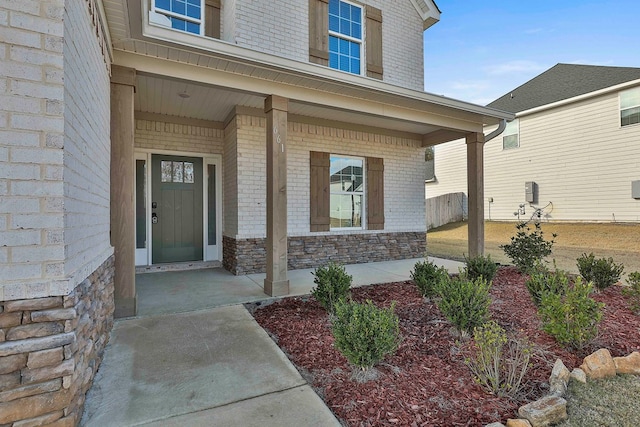 entrance to property featuring covered porch