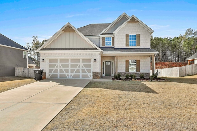 craftsman-style home featuring a garage and a front lawn