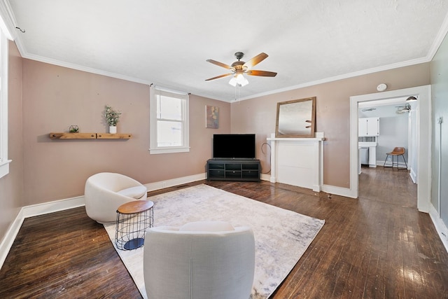 2418 34th St, Valley, AL 36854 - living room featuring dark wood-type flooring, ornamental molding, ceiling fan, and baseboards