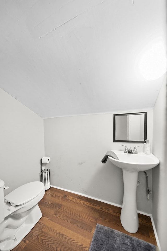 2418 34th St, Valley, AL 36854 - half bath featuring baseboards, wood finished floors, toilet, and lofted ceiling