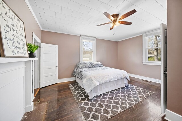 2418 34th St, Valley, AL 36854 - bedroom featuring visible vents, baseboards, hardwood / wood-style floors, and crown molding