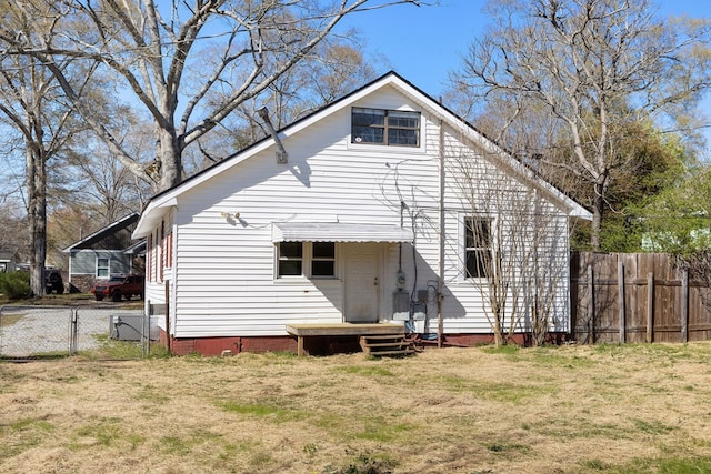 2418 34th St, Valley, AL 36854 - rear view of house featuring a yard, fence, and a gate