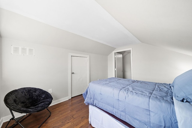 2418 34th St, Valley, AL 36854 - bedroom with visible vents, baseboards, vaulted ceiling, and dark wood finished floors
