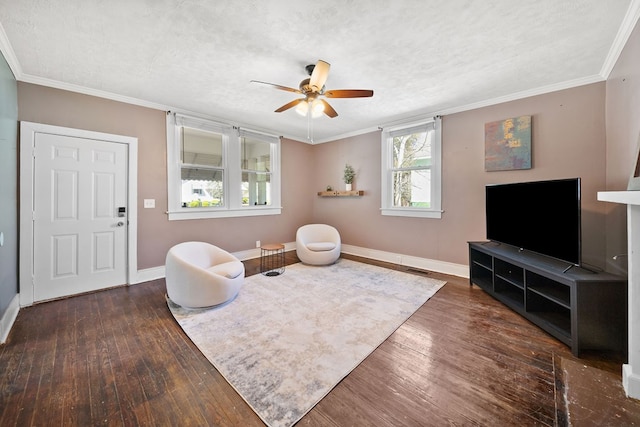2418 34th St, Valley, AL 36854 - living area featuring hardwood / wood-style floors, baseboards, a ceiling fan, and crown molding