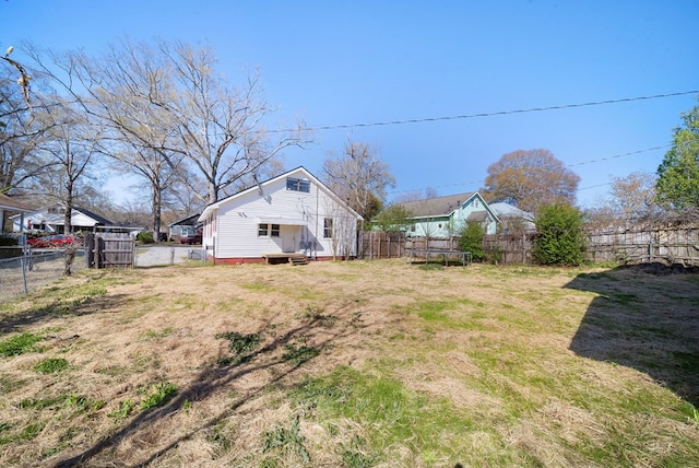 2418 34th St, Valley, AL 36854 - view of yard featuring a trampoline and a fenced backyard