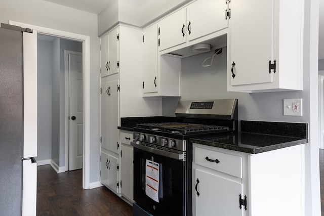 kitchen featuring stainless steel appliances, white cabinets, baseboards, and dark wood-style floors