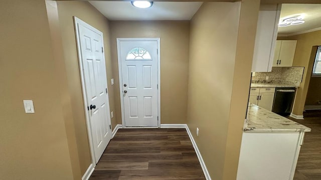 entryway featuring dark wood finished floors and baseboards